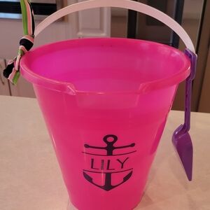 Pink Beach Bucket with Anchor Design personalized with the name Lily